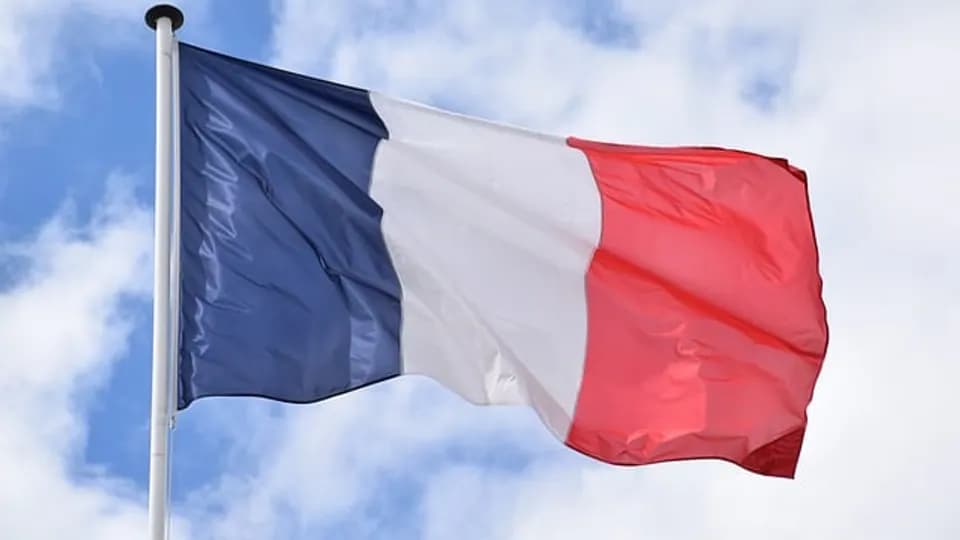 Drapeau français illustrant une formation en français langue étrangère.